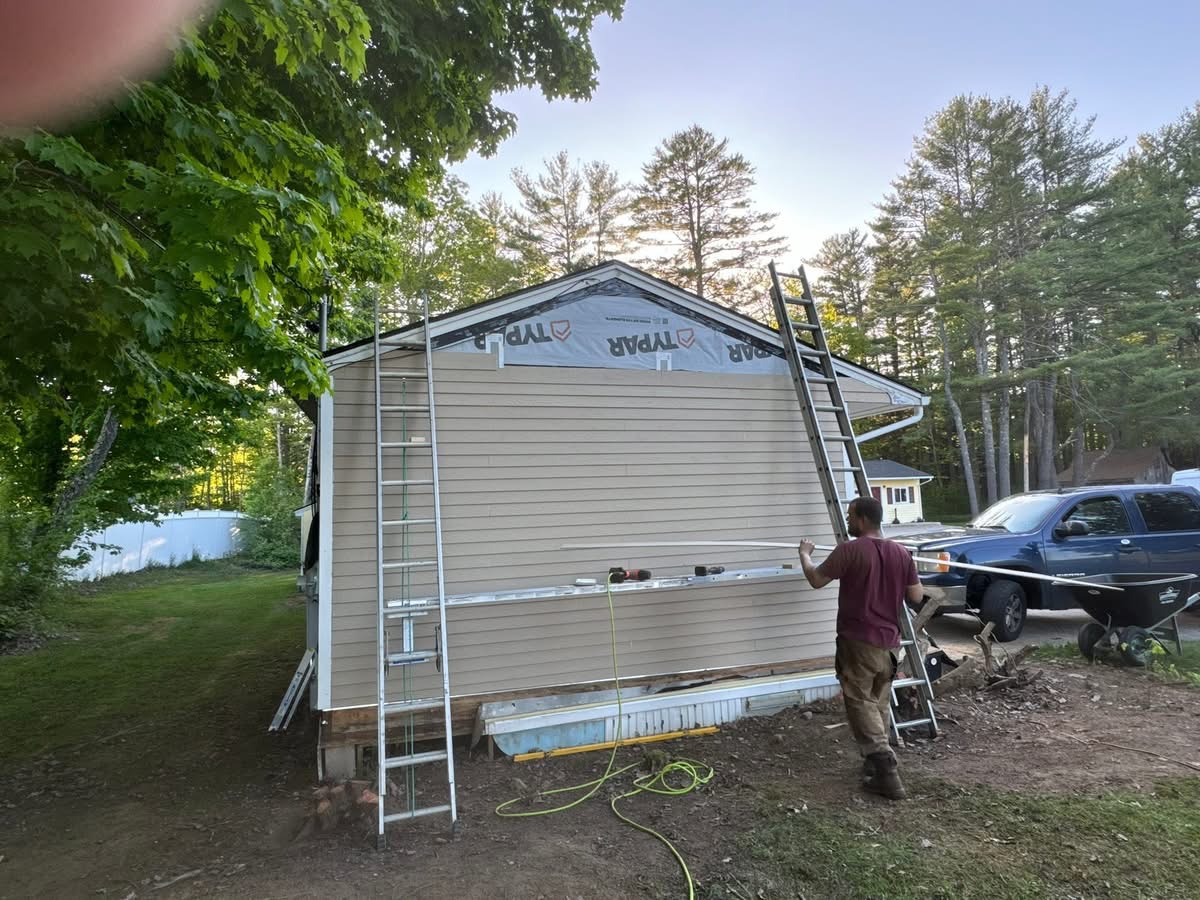 Fresh siding installation on a Maine home